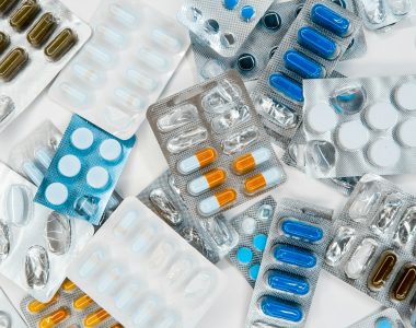 a pile of pills sitting next to each other on top of a table